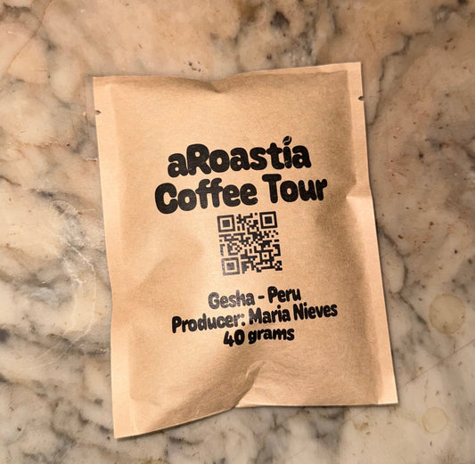 Coffee package from aRoastia Coffee Tour on a marble surface