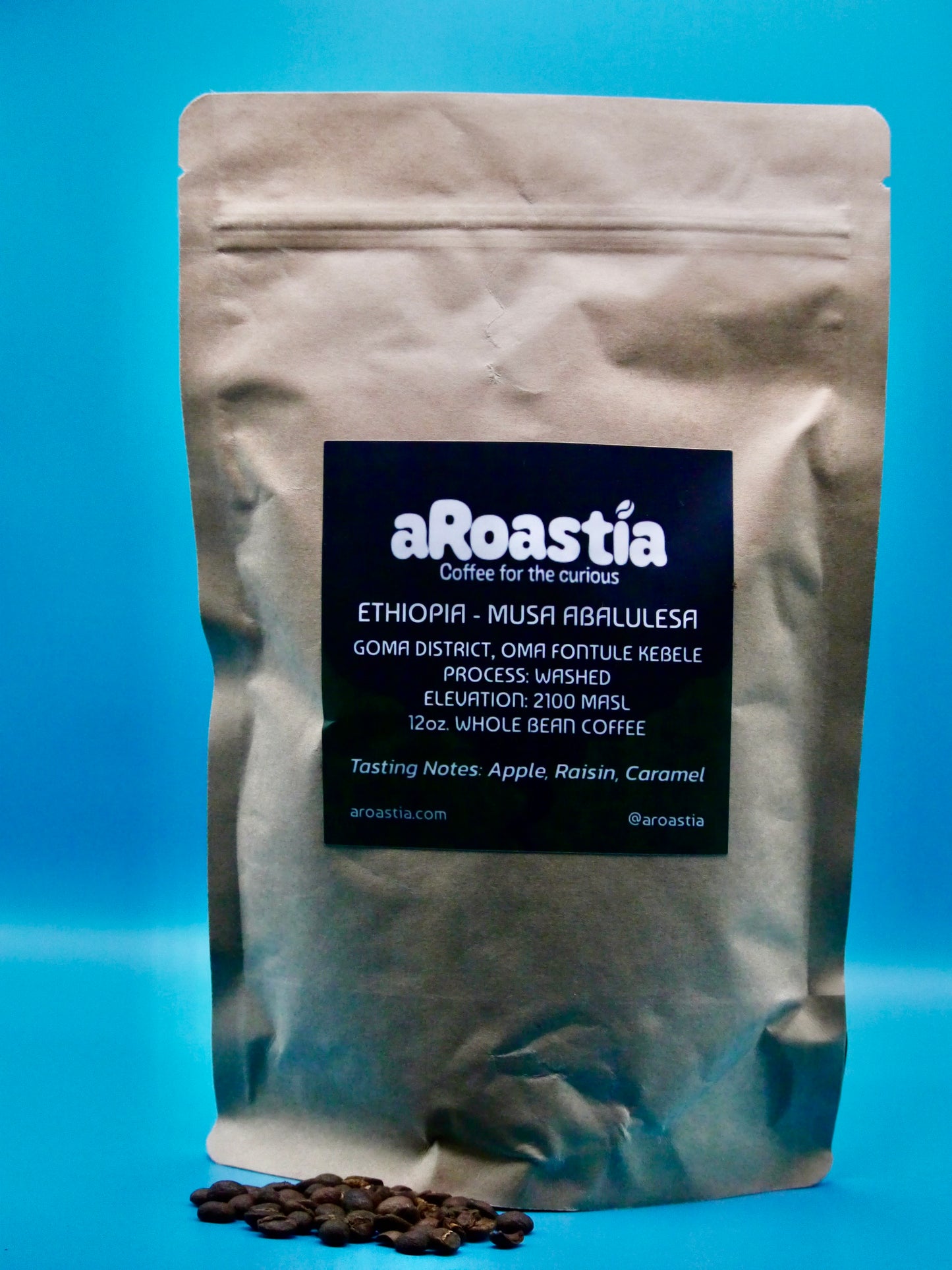 A phot of the bag of Musa Abalulesa beans that is for sale on the website, with beans poured out in front of the bag.