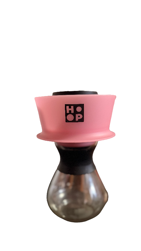 Pink and black coffee dripper on a white background